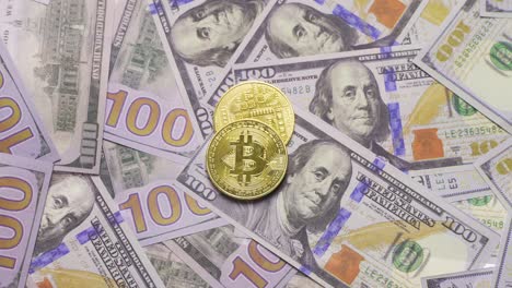 Hundreds-of-bills-and-yellow-bitcoins.